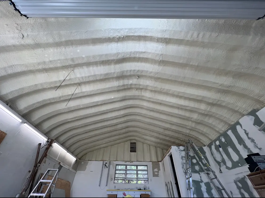 Spray polyurethane foam applied to the underside of a metal roof deck in Natchitoches